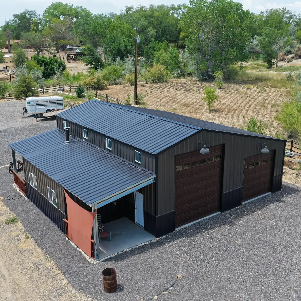 Dark metal RV and truck storage building with tall garage bays