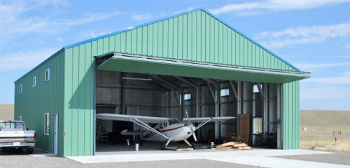 Whitestar steel aviation hangar with wide doors in Colorado.
