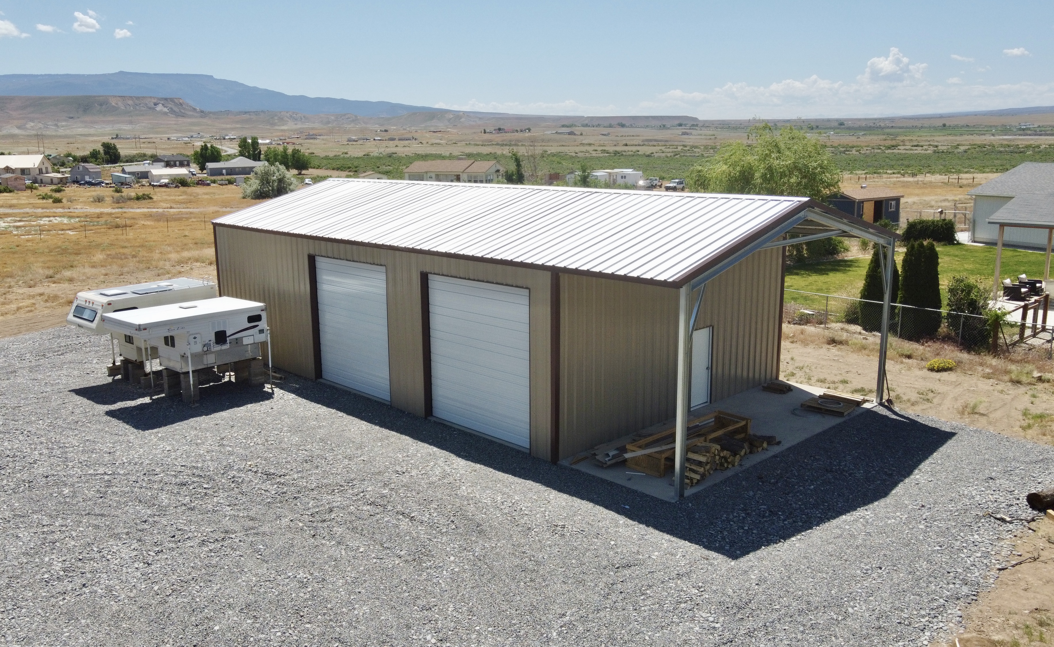 30'w x 50'l x 14'h (eave) with a 30'w x 10'l attached overhang