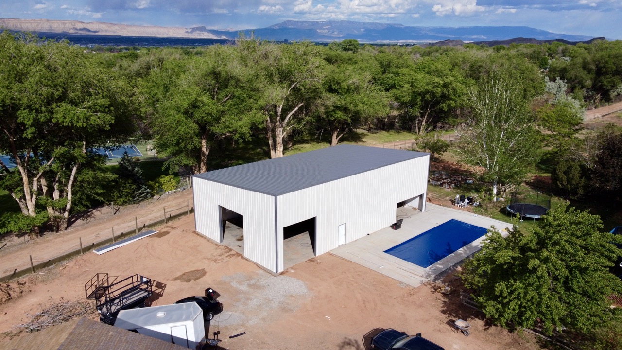 recent whitestar metal building project Redlands, Colorado measuring 40.0 feet wide by 70.0 feet long by 18.0 feet tall with 3 garage doors and 1 walk-in doors by Whitestar Metal Buildings